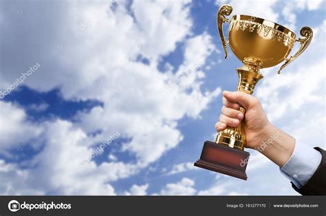Hand Holding Golden Trophy — Stock Photo © Billiondigital 161277170