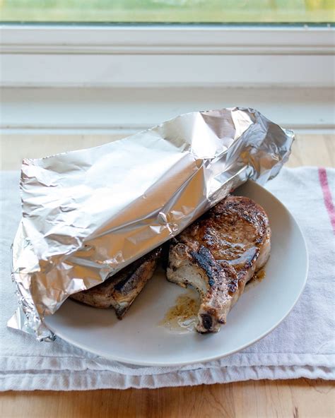 A classic american main course, pork chops are commonly served with fresh vegetables, a variety of different potato dishes and with a topping of applesauce. How To Cook Tender & Juicy Pork Chops in the Oven | Recipe ...