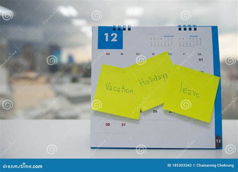 Vacation Holiday And Leave On Paper Note Stick On The Calendar Of