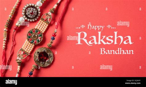 Raksha Bandhan Indian Festival With Beautiful Rakhi On Red Background