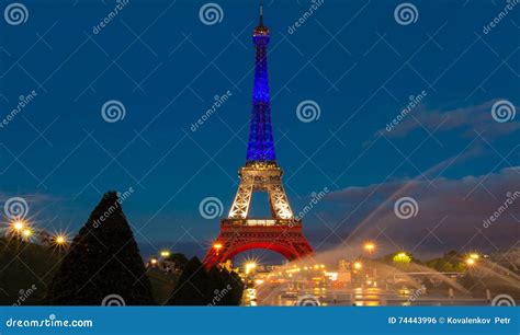 The Eiffel Tower Lit Up With The Colors Of French National Flag