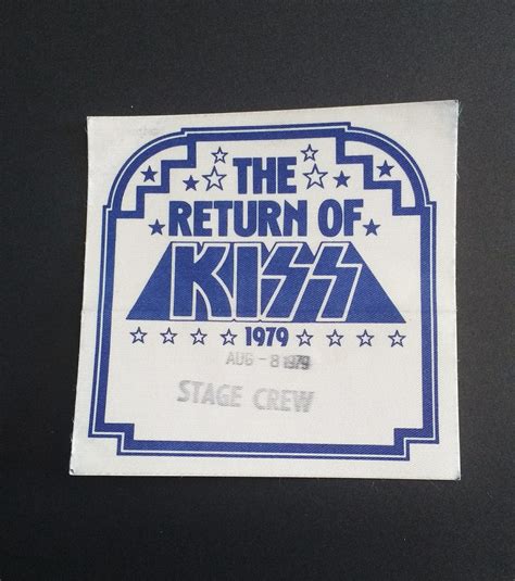 The Return Of Kiss Backstage Sticker On A Black Surface With White And
