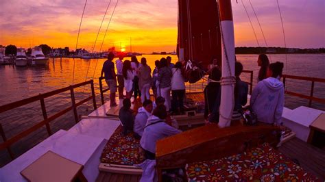 A Bachelorette Party On The Charter Catamaran Mon Tiki Coming Through Montauk Harbor At Sunset