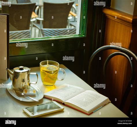 Glass Cup With Freshly Brewed Hot Green Tea Pot Honey Smartphone Open