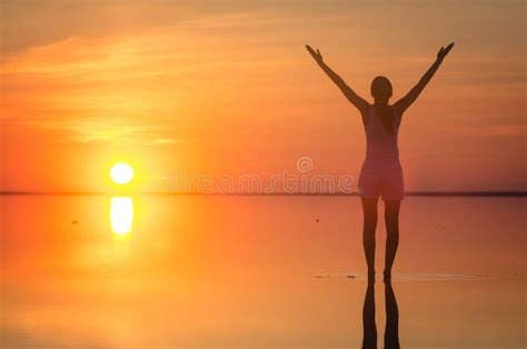 Beautiful Female Model Open Arms Under Sunrise At Seaside Calm Water Of Salt Lake Elton