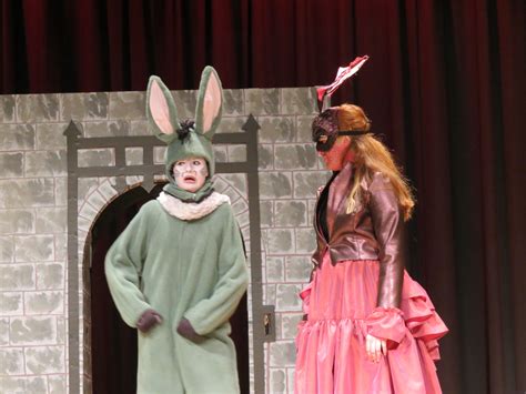 Donkey And Dragon Costumes On Stage Portcullis In Background Shrek