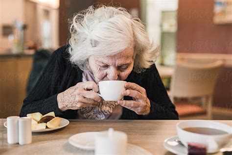 Old Woman Drinking Tea By Stocksy Contributor Irina Efremova Stocksy