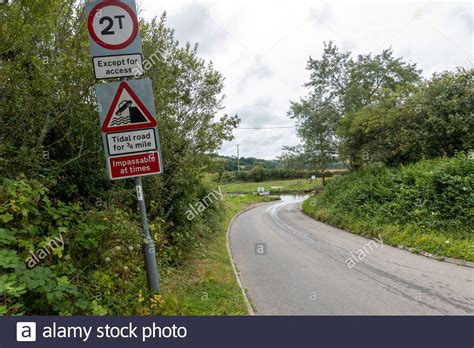 Warning Signs Tidal Road Aveton Ford Stock Photo Alamy