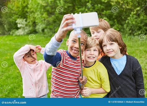 Group Of Kids Makes Selfie With Selfie Stick Stock Photo Image Of