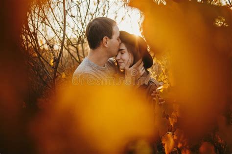 Stylish Sensual Couple Embracing In Warm Sunset Light In Autumn Field Gently Hugging In