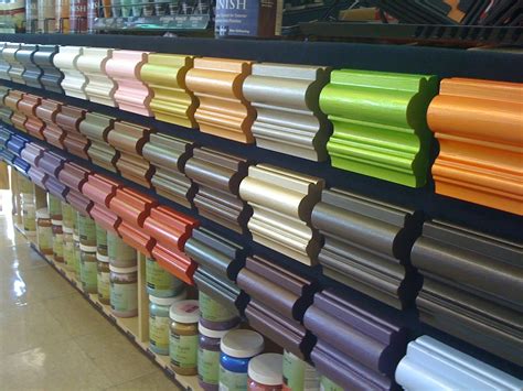 Many Different Colored Cups Are On Display In A Store Shelf With The