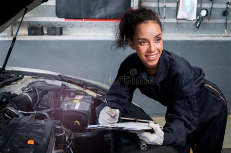 Beautiful Female Auto Mechanic Working In Garage Car Service
