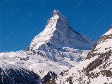 The Immaculate Peak Of The Matterhorn Rises Above The Village Of