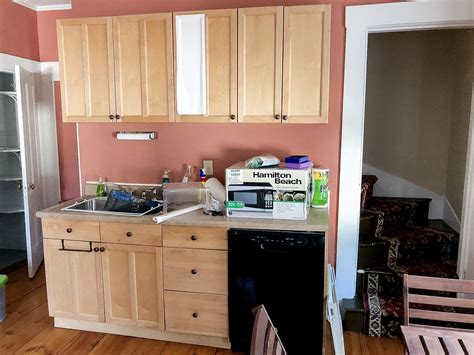 Carefully stick one part on the drawer edge. How to Make Over a Kitchen With Contact Paper: Covering ...