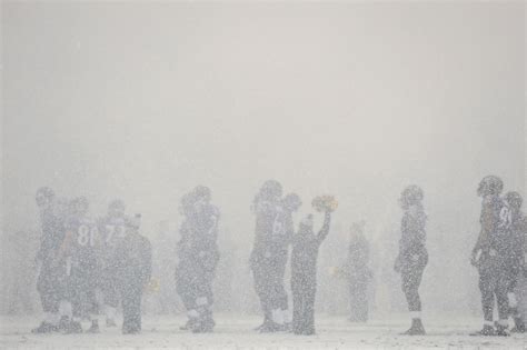 Nfl Players Plow Through Snowy Football Fields