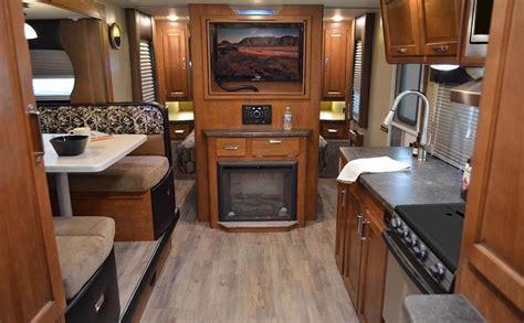 As a custom builder of towable rvs, we start with a very affordable base trailer and offer a much larger selection of options than our competitors. Travel Trailer 2295 | Fireplace set, Travel trailer, Kitchen