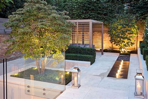 A Romantic Lit Fountain Softens This Contemporary Landscaped Patio
