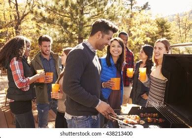 Group Friends Stand Barbecue One Cooking Stock Photo