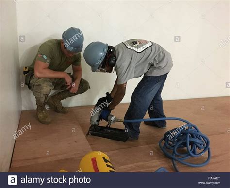 Dillion A Builder Apprentice Learns To Use The Pneumatic Nailer While