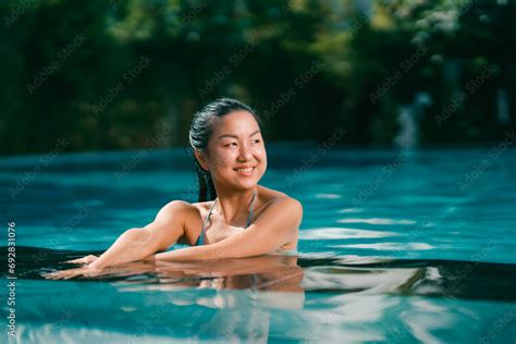 Young Asian Woman Relaxing In The Water Beautiful Girl Relaxing At Overwater Infinity Pool