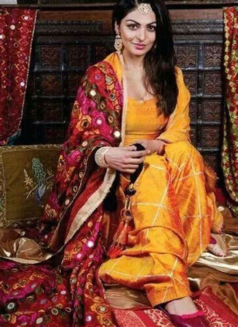 Neeru Bajwa Mango Yellow Color Raw Silk Punjabi Salwar Kameez With Phulkari Dupatta At Zikimo 1