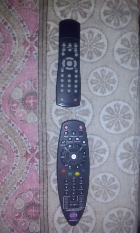 Press red button and ok button together untill red light blinks twice.2. How to pair Videocon D2H Universal Remote to TV Remote