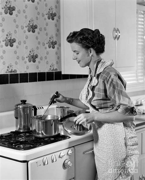 Woman Cooking On Stovetop C1950s Photograph By H Armstrong Roberts