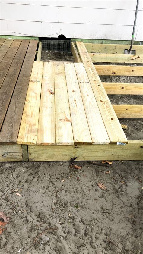 Summer times, in conjunction with mitre 10, shows you how to build a deck. How I Built my DIY Floating Deck for less than $500 | Diy deck, Floating deck, Building a deck