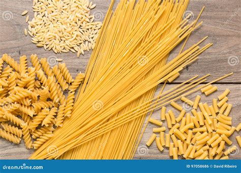 Spaghetti And Different Types Of Pasta On Top Of A Table Stock Photo