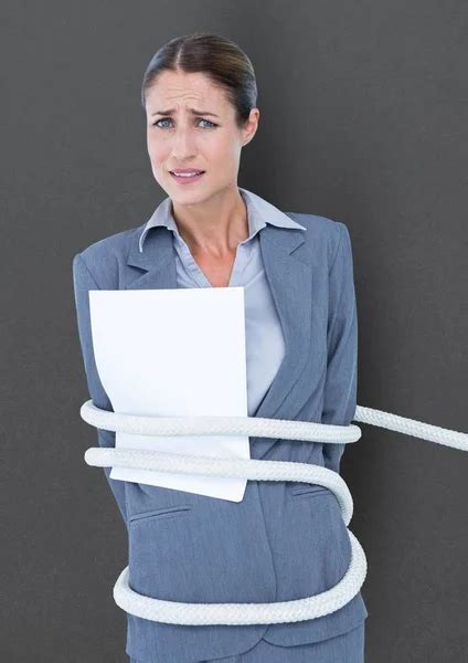 Businesswoman Tied Up With Rope And Paper Stock Photo By