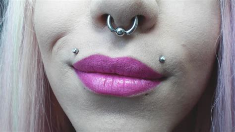 Septum And Top Lip Piercings With Silver Studs