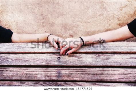 Two People Holding Hands On Bench Stock Photo Edit Now 154771529