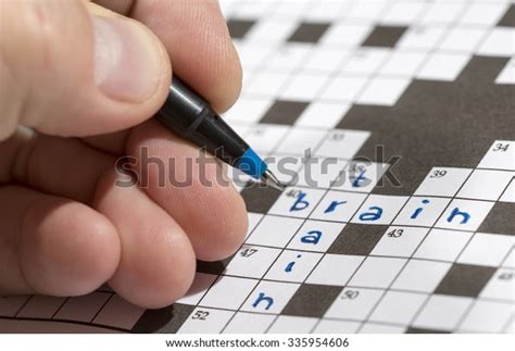 Man Doing Crossword Puzzle Man Holding Stock Photo Edit Now 335954606