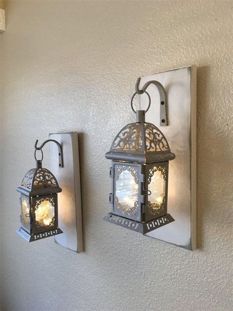 How to hang a rug as wall art. Gray Hanging Lantern Sconces, Farmhouse Wall Decor, Lantern Sconces, Black, Lanterns, Wood ...