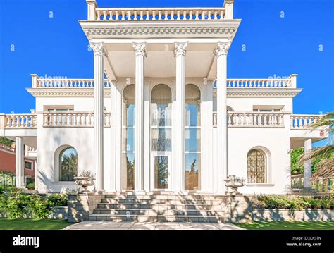 The Facade Of A Luxurious Residence With Columns In The Corinthian