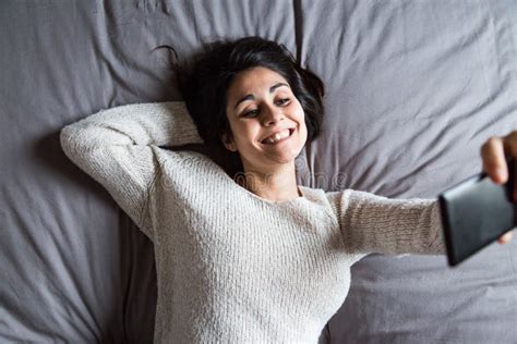 Young Woman Taking A Selfie On Bed Stock Image Image Of Business Cozy 86172943