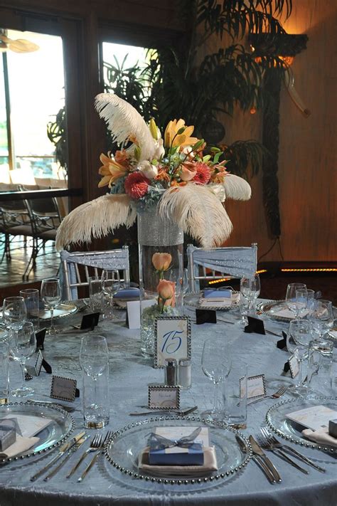 These White Feathers Accent This Color Centerpiece Perfectly Photo