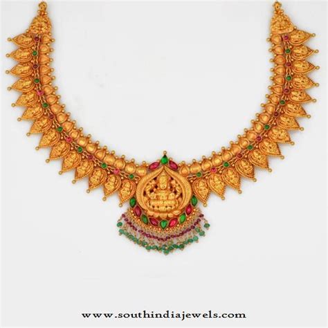 gold temple jewellery designs lakshmi necklace south india jewels