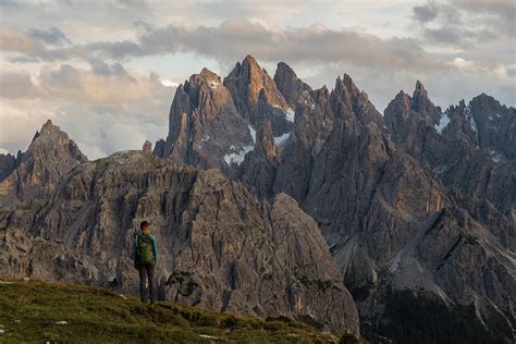 Young Female Enjoys Sunset In The Dolomites Mountains