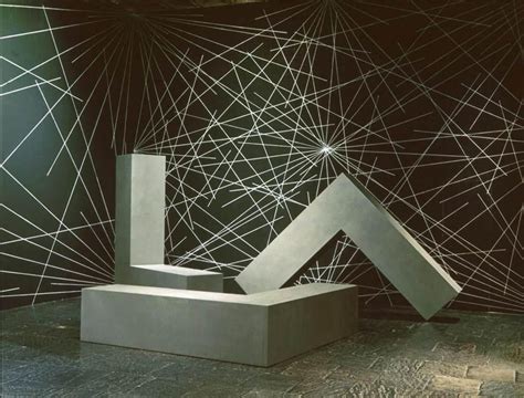 An Abstract Sculpture Is Shown In Front Of A Black And White Wall With