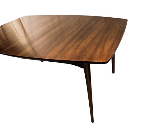 The table is made from engineered wood with a circular surface that has an inlaid wood grain starburst. Mid Century Modern Expandable Dining Table | Mary Kay's ...
