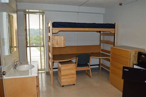 There Is A Bunk Bed And Desk In The Room