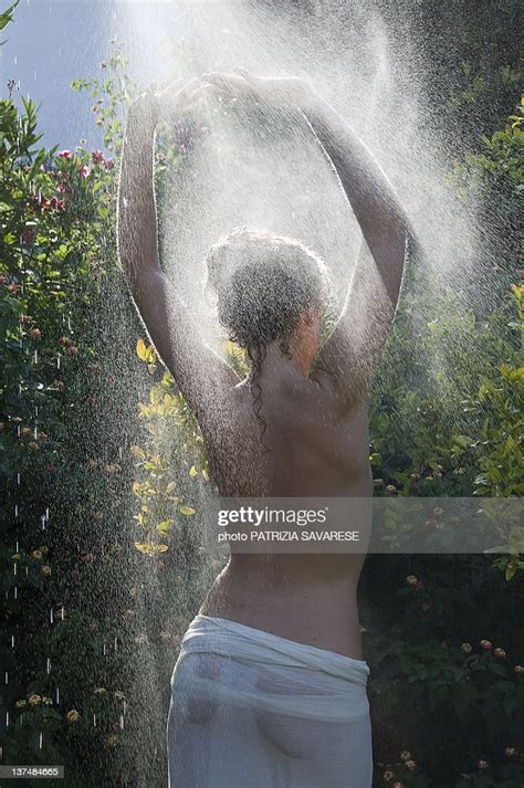 Girl Having Shower In Garden High Res Stock Photo Getty Images