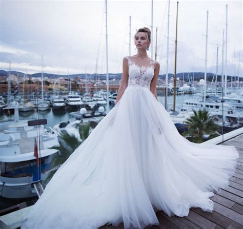 romantic wedding dress flowing tulle lace illusion neckline with buttons