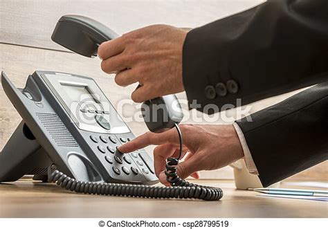 Communication Operator Dialing A Telephone Number While Holding A