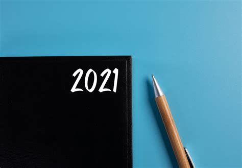 Notebook with 2021 Today's Agenda text on blue background - Creative ...