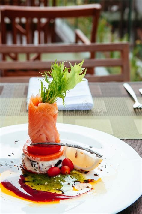 Smoked salmon salad is a colourful dish combining the crunch of black olives with the zest of fresh lemon juice. Fine Dining Meal, Smoked Salmon Stock Image - Image of ...