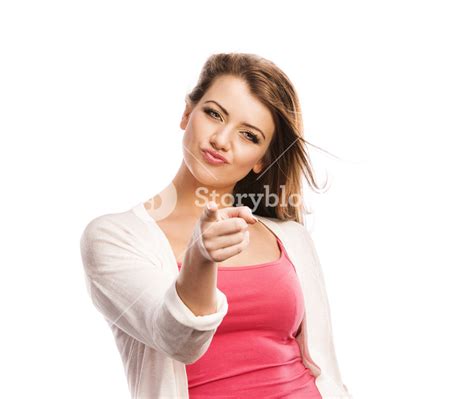 Beautiful Young Woman Pointing To The Camera Isolated Over A White