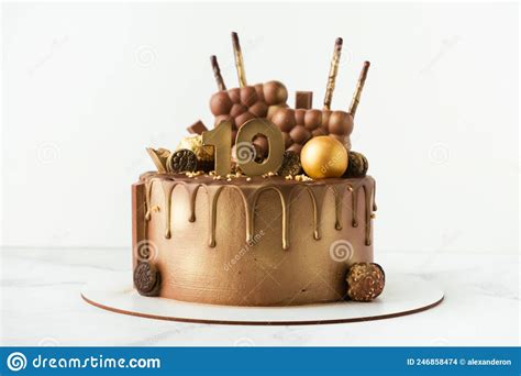 Luxury Birthday Chocolate Cake With Drips Decorated With Candies Covered With Brown And Golden