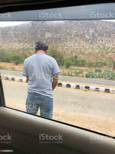 Image Of Indian Man Having A Pee Man Peeing By Roadside Highway With